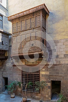 Facade of Zeinab Khatoun historic house with Mamluk era style oriel window Mashrabiya, Cairo, Egypt photo