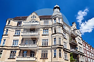 Facades with balconies of historic tenement houses in the city of Poznan