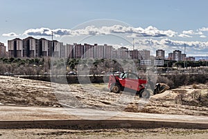 Facades of buildings in an urbanization with a park under constructio