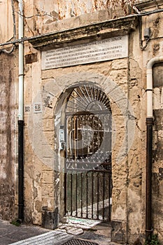 Facades of buildings very spoiled in the historic center of Ortigia, Syracuse, Siciklia, Italy