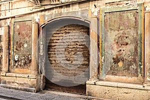 Facades of buildings very spoiled in the historic center of Ortigia, Syracuse, Siciklia, Italy