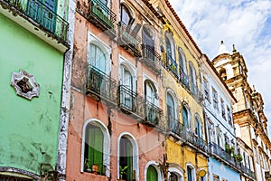 Facades of colorful houses and church