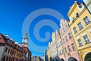 Facades of historic houses and tower of the town hall on the Market Square