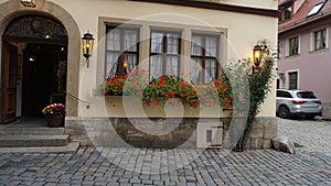 The facades of historical buildings at Rothenburg ob der Tauber where is the fortified city at Germany.