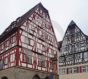 The facades of historical buildings at Rothenburg ob der Tauber where is the fortified city at Germany.