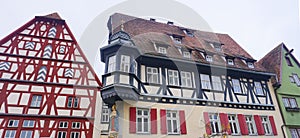 The facades of historical buildings at Rothenburg ob der Tauber where is the fortified city at Germany.