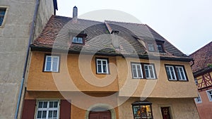 The facades of historical buildings at Rothenburg ob der Tauber where is the fortified city at Germany.