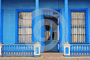 Facades of houses in the Calle Baquedano in the typical architecture style of Iquique, North Chile, South America