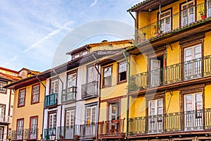 Facades of houses at Largo da Oliveria in the old town of Guimaraes, Portugal