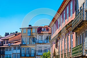 Facades of houses at Praca de Sao Tiago in the old town of Guimaraes, Portugal