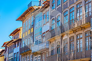 Facades of houses at Praca de Sao Tiago in the old town of Guimaraes, Portugal