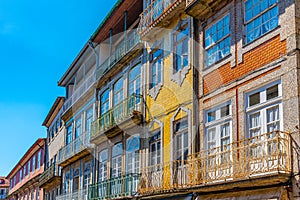 Facades of houses at Praca de Sao Tiago in the old town of Guimaraes, Portugal