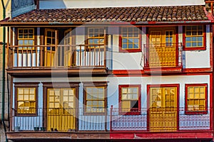 Facades of houses at Praca de Sao Tiago in the old town of Guimaraes, Portugal
