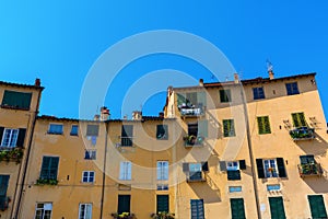 Facades of old buildings in Lucca, Italy