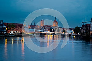 facades of old medieval houses on the embankment in Gdansk on the banks of the river MotÅ‚awa. Gdansk, Poland