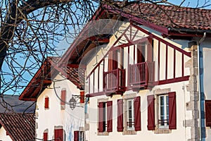 Facades of typical Basque houses in the touristic village of Ainhoa, France