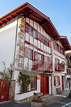 Facades of typical Basque houses in the touristic village of Ainhoa, France