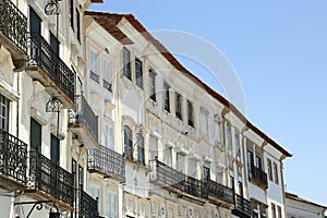 Facades of typical buildings at PraÃ§a do Giraldo, Ãvora, Alentejo, Portugal photo