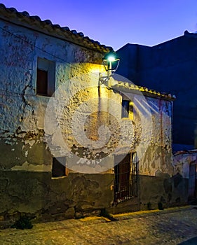 Facades of whitewashed old houses at dusk in the picturesque village of Velez Rubio, Almeria. photo