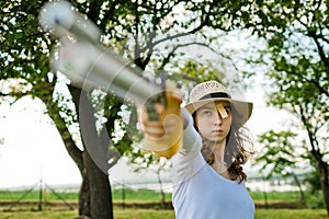 Face of aiming sport female shooter during concentration before