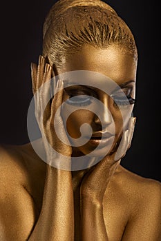 Face Art. Fantastic Gold Make Up. Stylized Colored Woman's Body