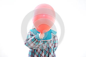 Face balloon. head ball. Child with red baloon isolated on white