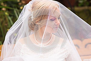 Face of a beautiful bride hidden veil