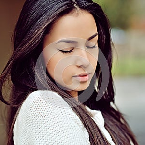 Face of a beautiful girl with eyes closed - close up