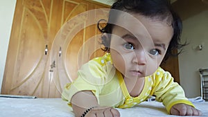 Face of Beautiful Infant looking at camera with open eyes