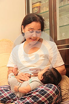 Face of Beautiful Infant smiling and playing with grand mother