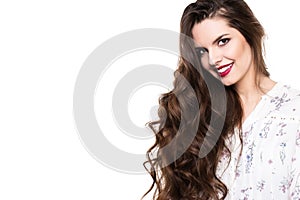Face of the beautiful woman with long curly hair isolated on white background.