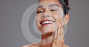 Face, beauty and laughing with smile of woman in studio on gray background for health, humor or wellness. Skincare