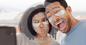 Face, beauty and selfie with a couple using an under eye mask while joking and playing with a phone in the bathroom at