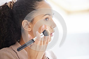 Face, beauty and woman with makeup brush in home for skincare, health or treatment in bathroom. Cosmetics, product and