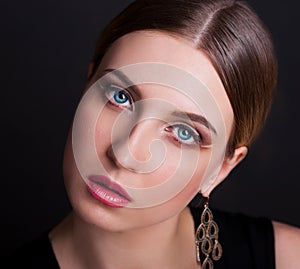 Face, blue eyes, black background, haired hair, gold earrings