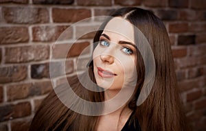 Face, blue eyes, smile, brick wall background