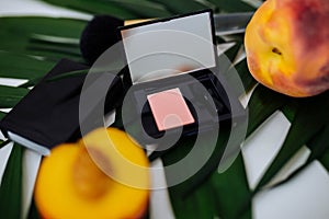 Face blush lie near juicy peaches