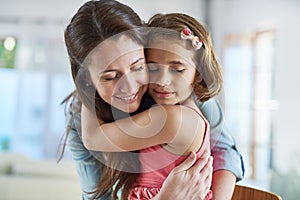 Face, calm mother and girl hug for support in home for care, safety and bonding together to relax. Smile, love and proud