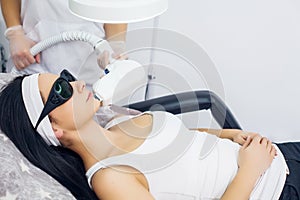 Face Care. Facial Laser Hair Removal. Beautician Giving Laser Epilation Treatment To Young Woman`s Face At Beauty Clinic. Body Ca