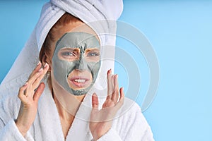 Face care. Irritated caucasian woman use mask for face