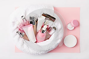 Face care and make up products covered in towel