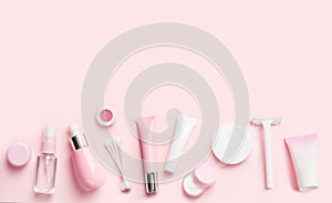 Face care products on pink in view of border