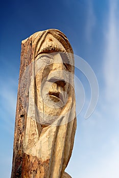 Face Carved on Tree Trunk