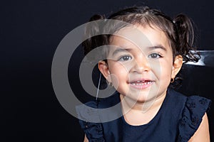 Face child girl portrait happy smile in black background