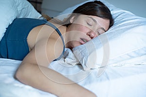 Face close up portrait of woman sleeping in bed and snoring