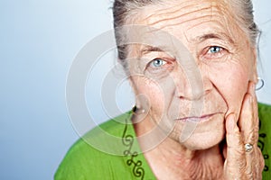 Face of content beautiful old senior woman