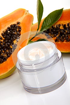 Face cream and fresh papaya