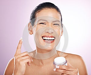 Face, cream jar and skincare of woman in studio isolated on purple background. Mature portrait, cosmetics and funny