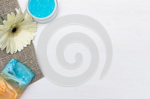 Face cream, white gerbera flower and blue essential oil. Bath accessories. Spa. Aroma therapy.