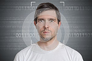 Face detection and recognition of man. Computer vision concept. Binary code in background